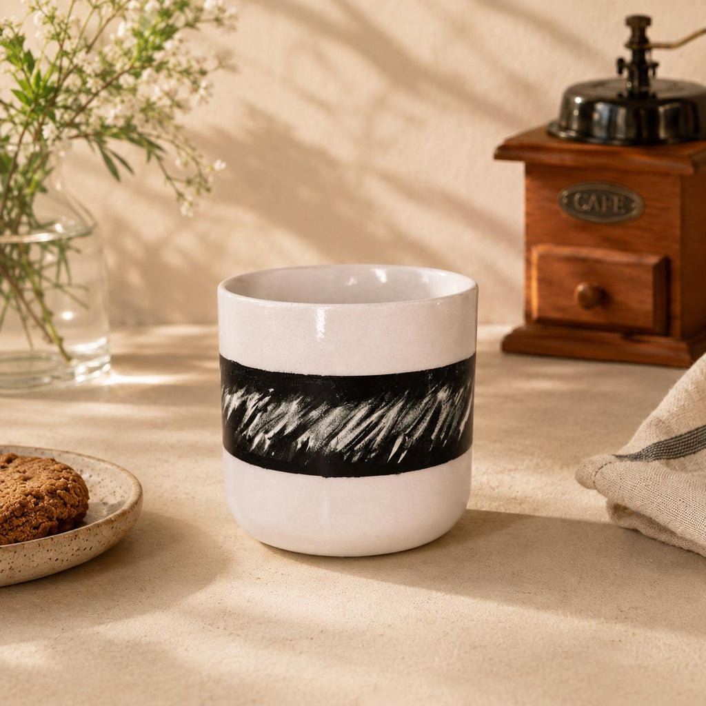 Stacked loop handle on a monochrome ceramic mug