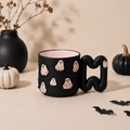 Black ghost porcelain mug with pink ghosts and wavy handle by HUE Atelier
