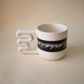 Hand-painted black ink pattern porcelain mug with zigzag handle by HUE Atelier