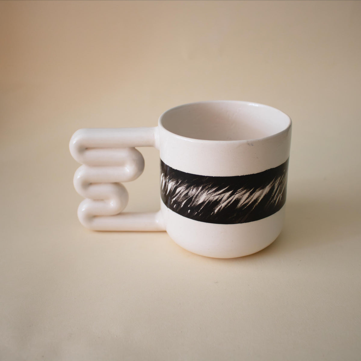 Hand-painted black ink pattern porcelain mug with zigzag handle by HUE Atelier