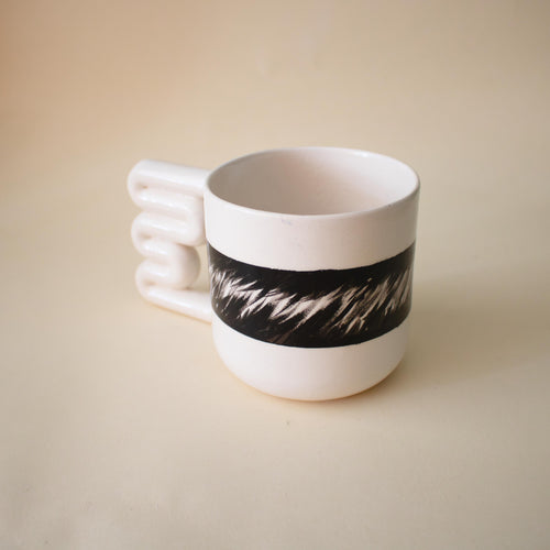 Glossy white mug with flowing black abstract brushwork