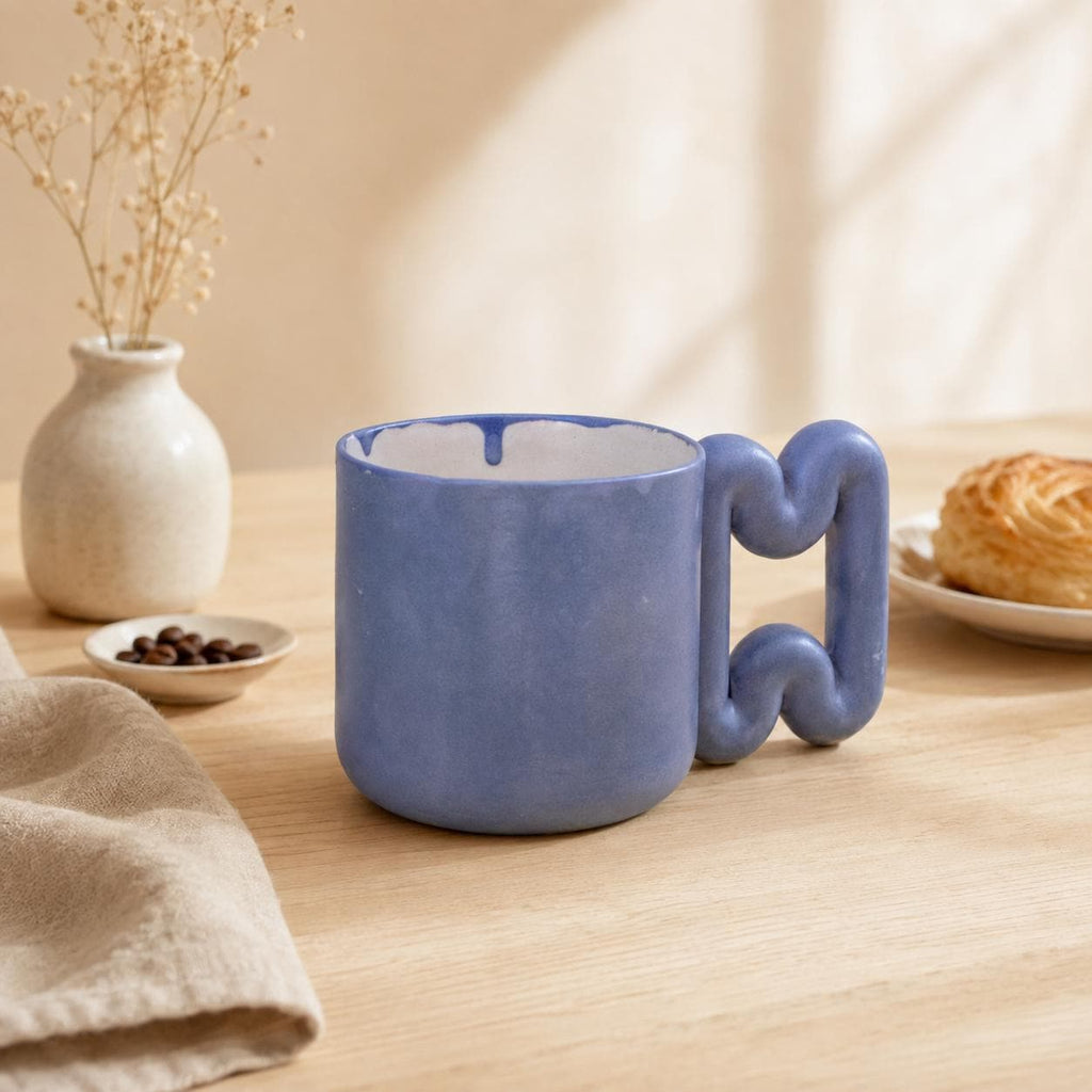 Rich blue glazed coffee mug with soft curved handle