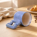 Blue handmade mug on a modern coffee station