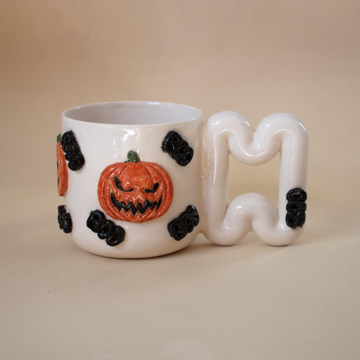 Hand-sculpted pumpkin Halloween porcelain mug with BOO lettering by HUE Atelier