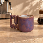 Glossy copper, rose and purple glaze on a large coffee mug