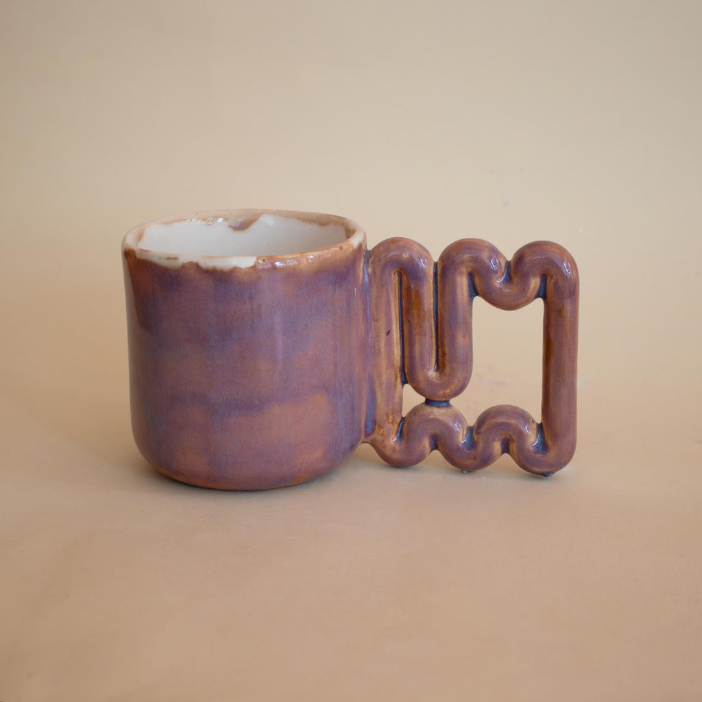 Geometric square-wave handle on a handmade porcelain mug