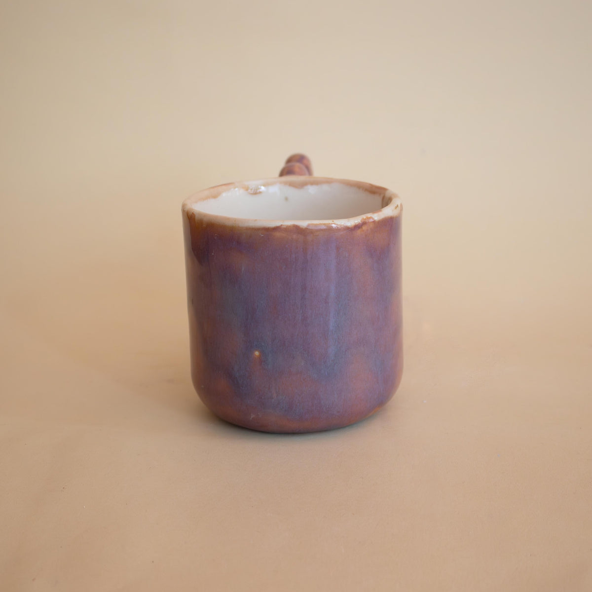 Colour-shifting glaze detail on a handmade mug