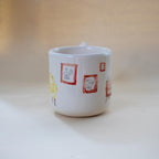 Zigzag handle on a one-of-a-kind illustrated mug