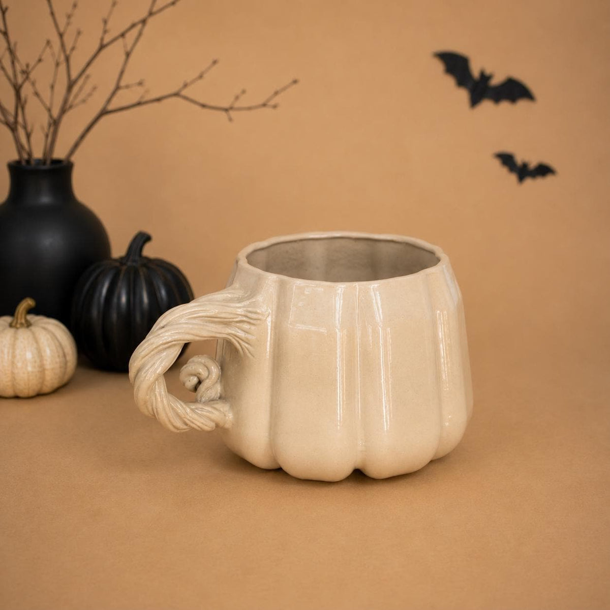 Ribbed pumpkin shape in warm cream glaze