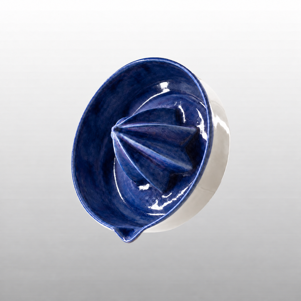 Deep blue and white porcelain citrus juicer by HUE Atelier
