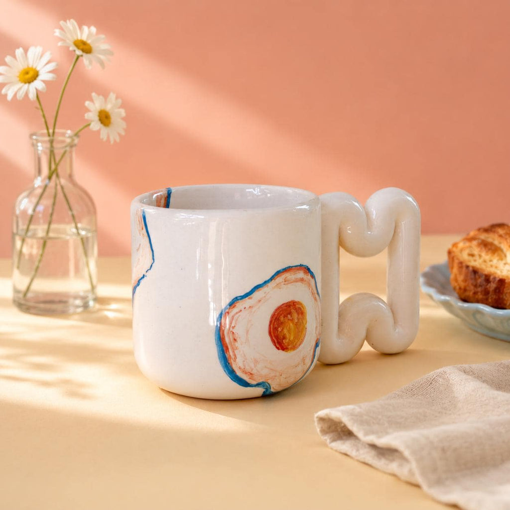 Fried egg porcelain mug with sculptural wavy handle by HUE Atelier