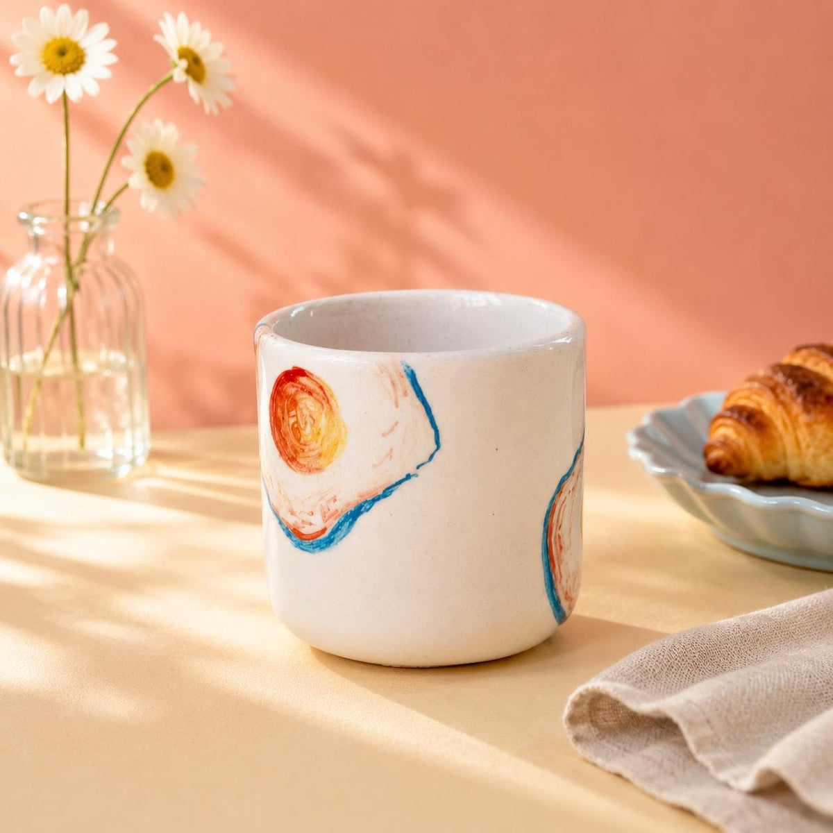 Colourful fried egg illustration with blue outline on a white mug