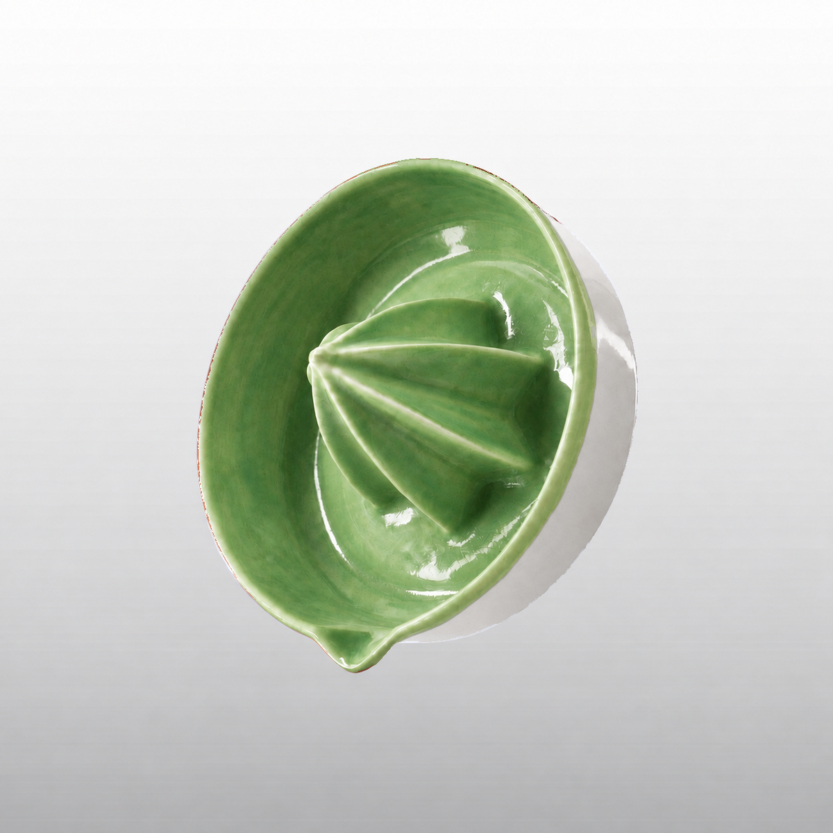 Glossy green porcelain citrus juicer with pour spout by HUE Atelier