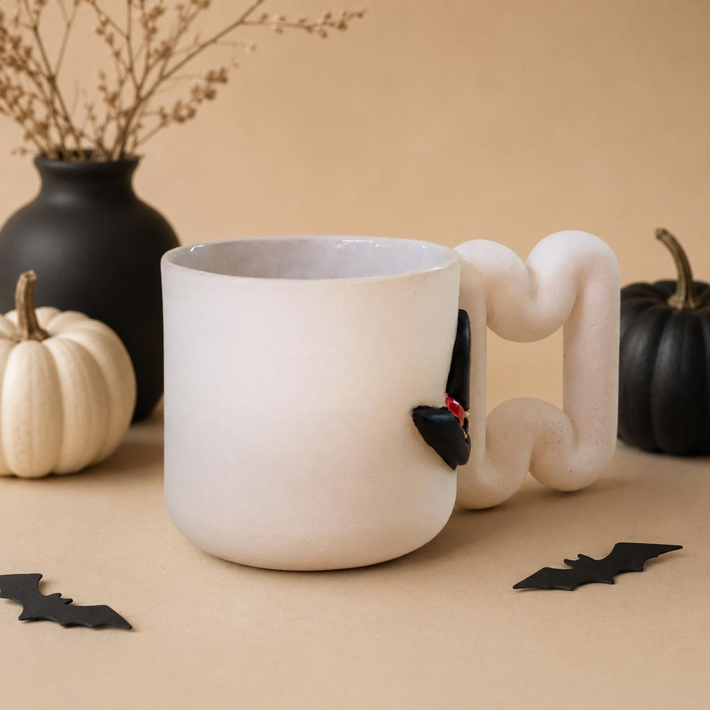 Halloween witch mug in matte white porcelain with glossy black raised details