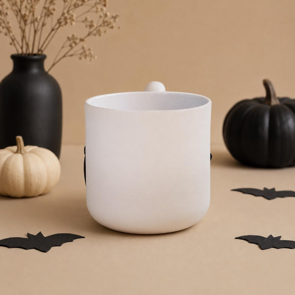 Wavy squiggle handle on a handmade porcelain witch coffee mug