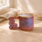 Light interior of a variegated purple ceramic cup