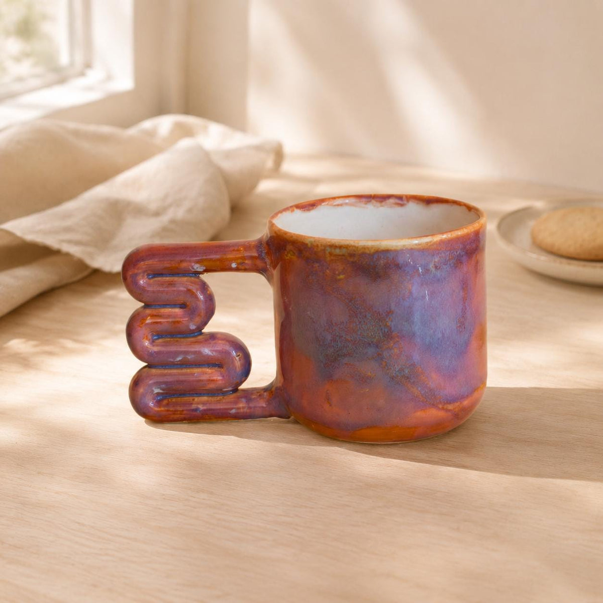 Light interior of a variegated purple ceramic cup