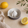 Matte coffee brown porcelain citrus juicer with pour spout by HUE Atelier