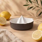 Glossy white ridged reamer inside a brown lemon squeezer