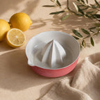 Matte red porcelain citrus juicer with faceted reamer by HUE Atelier