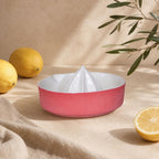 Bold red handmade kitchenware for fresh lemon juice
