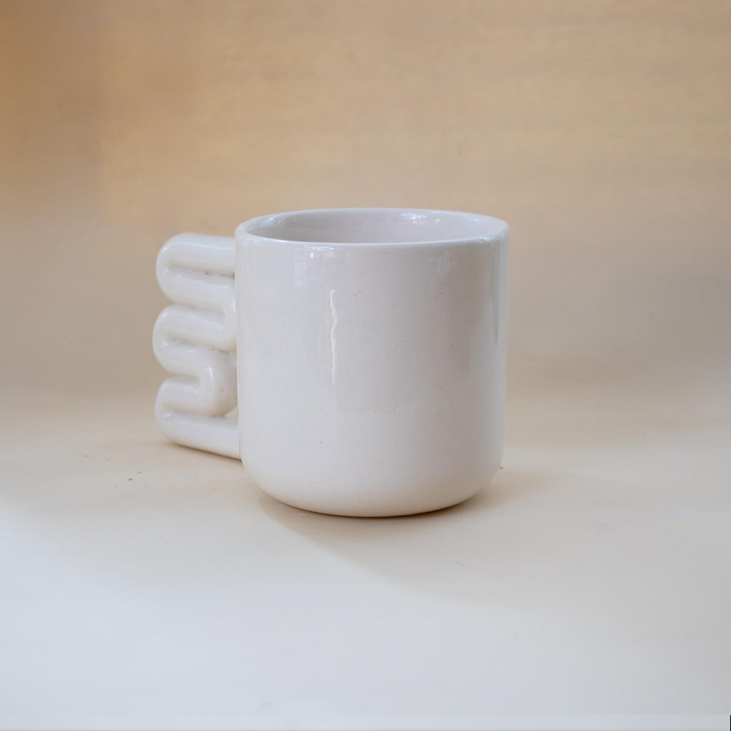 Simple handmade porcelain mug for everyday coffee