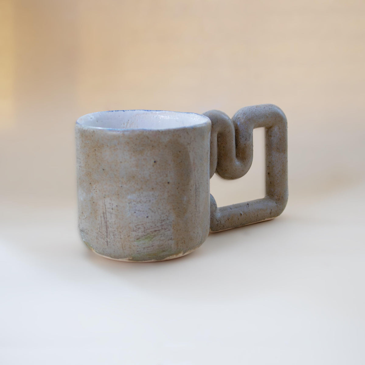 Matte speckled glaze on a minimalist coffee mug