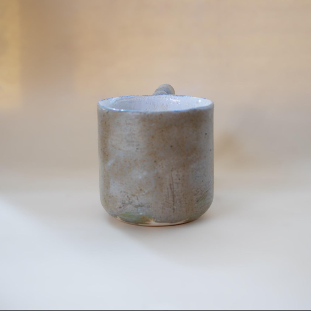 Funky zigzag handle on a stone-look ceramic cup