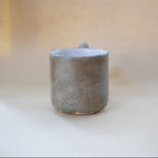 Funky zigzag handle on a stone-look ceramic cup