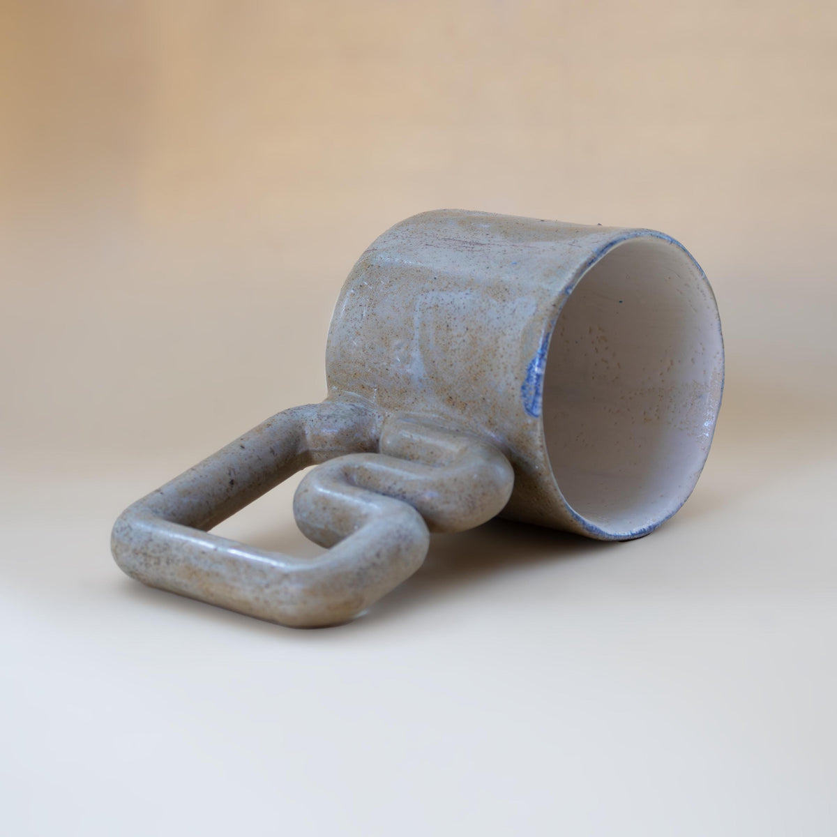 Natural stone speckled porcelain mug with funky handle by HUE Atelier – photo 6