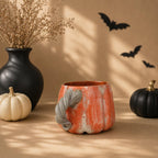 Pumpkin mug styled for a Halloween table