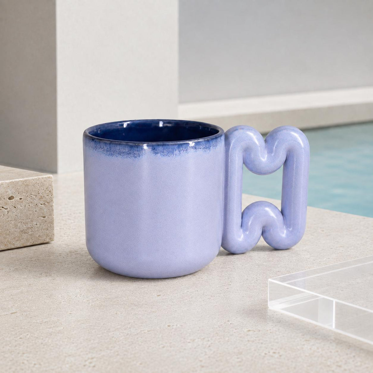 Soft blue coffee mug with deep navy interior