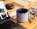 Pastel blue mug on a minimalist coffee station
