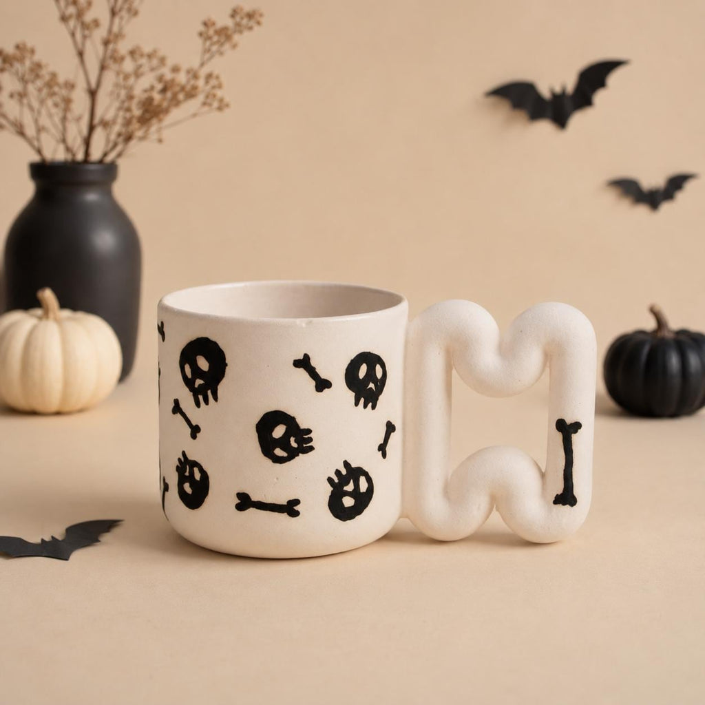 Handmade skull and bones gothic porcelain mug with squiggle handle by HUE Atelier