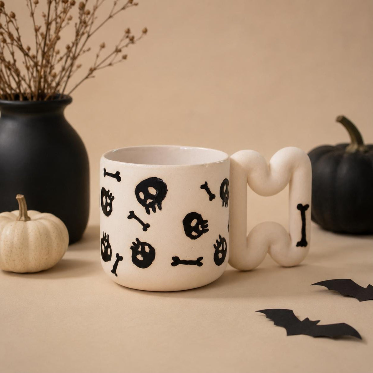 Gothic skull coffee mug in matte white porcelain with glossy black skulls