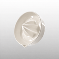 Warm white porcelain citrus juicer with pour spout by HUE Atelier