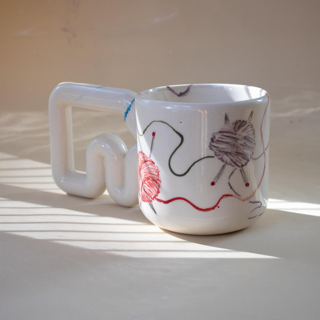 One-of-a-kind knitter mug with looping threads