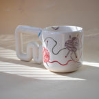 One-of-a-kind knitter mug with looping threads