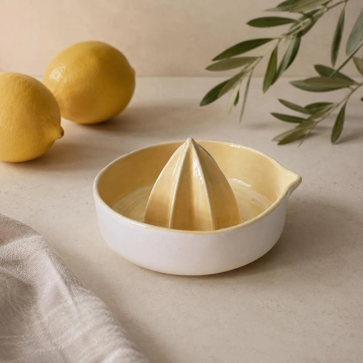 Pour spout on a yellow handmade juicer
